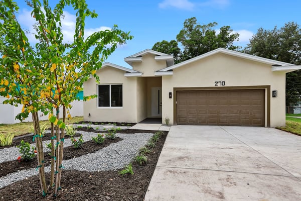 This modern home features a spacious layout, low-maintenance landscaping, and a convenient two-car garage.