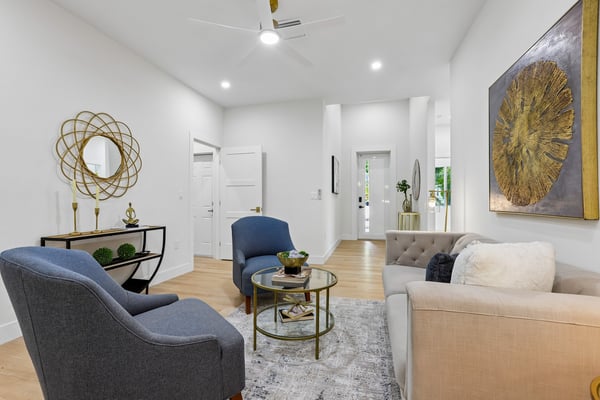 Bright and inviting living space, featuring modern decor and ample natural light, perfect for entertaining.