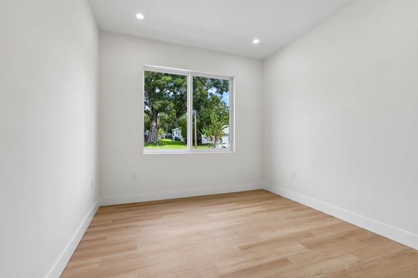 Bright, versatile room with abundant natural light and a large window
