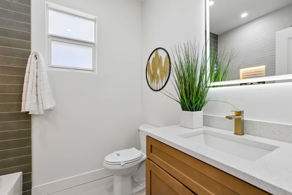 Modern bathroom featuring a sleek design, ample natural light, and contemporary fixtures for everyday comfort.