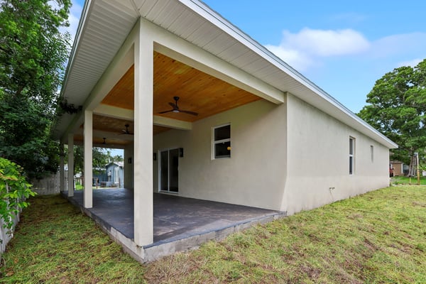 spacious covered patio perfect for outdoor gatherings, offering a seamless transition to the backyard and nature.