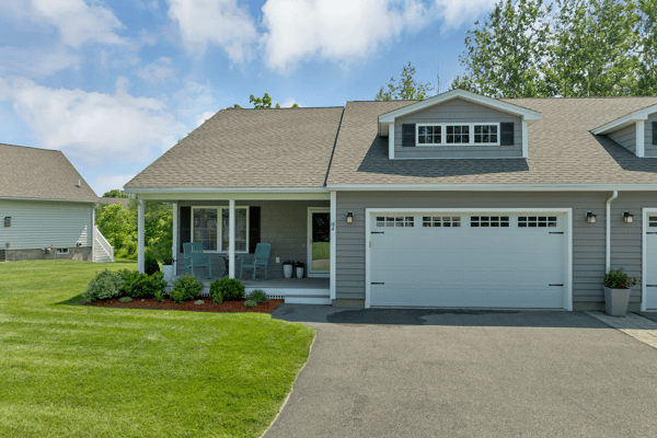 This inviting home features an ample front yard, covered porch, and convenient garage space.