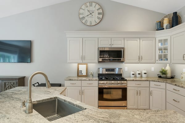 This modern kitchen features sleek cabinetry, high-end appliances, and ample natural light. Ideal for cooking and entertaining.