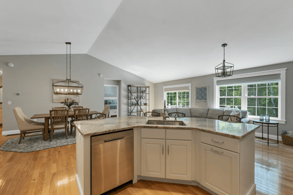 Bright and open living space featuring a modern kitchen seamlessly connected to the inviting dining area.