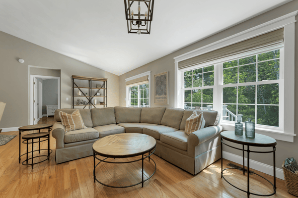 Bright, inviting living space featuring abundant natural light and modern furnishings, perfect for relaxation and gatherings.