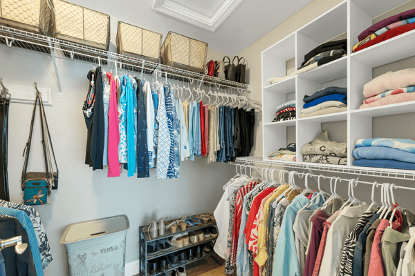Spacious and organized closet featuring ample shelving and hanging options for efficient storage and easy access.