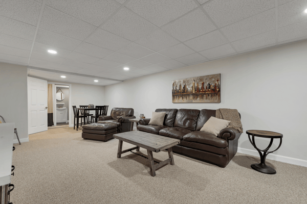Spacious, versatile basement offers a comfortable living area, perfect for relaxation and entertainment.