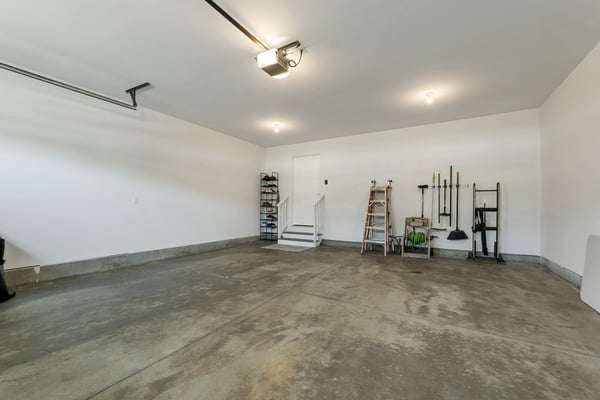 Spacious garage offering ample storage solutions and convenient access to the home’s interior.