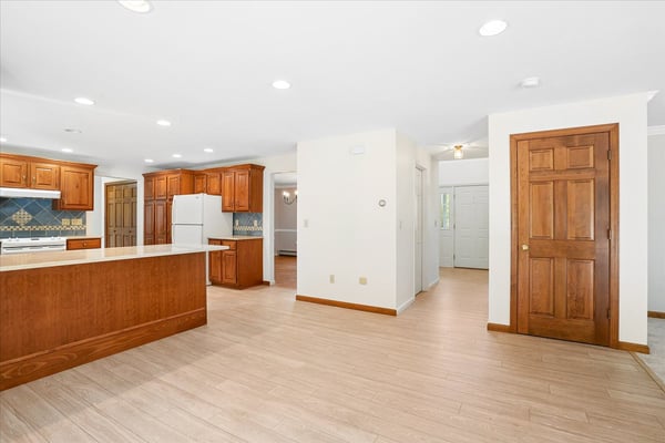 Spacious open-concept kitchen and living area with ample natural light and modern finishes throughout.