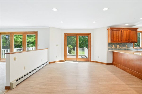 Spacious open-concept living area featuring natural light, premium finishes, and direct access to outdoor space.