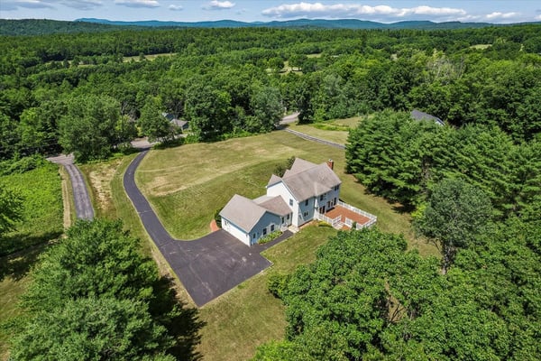 Spacious home on a large lot, surrounded by lush greenery and scenic mountain views. Perfect for tranquility!