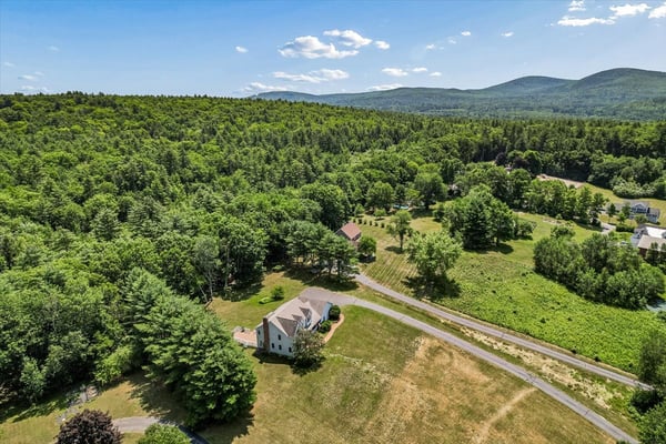 Expansive property with sprawling landscapes and mountain views, perfect for outdoor enthusiasts and peaceful living.