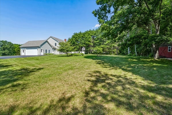Spacious property featuring a vast lawn, ideal for outdoor activities and future landscaping opportunities.