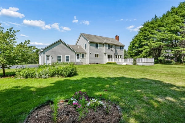 Spacious home featuring a large yard, perfect for outdoor activities and entertaining in a tranquil setting.