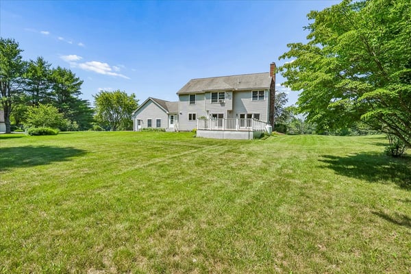 Spacious home surrounded by lush greenery, offering a peaceful retreat with ample outdoor space.