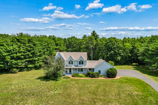 Spacious home on a large lot, surrounded by lush greenery and offering ample outdoor space.