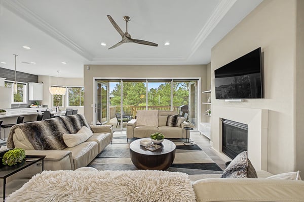 Bright and inviting living space featuring large windows that offer scenic views and modern amenities.