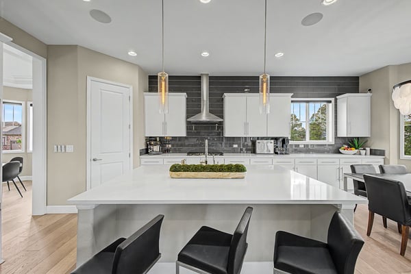 Contemporary kitchen featuring sleek cabinetry, a spacious island, and high-end stainless steel appliances for modern living.