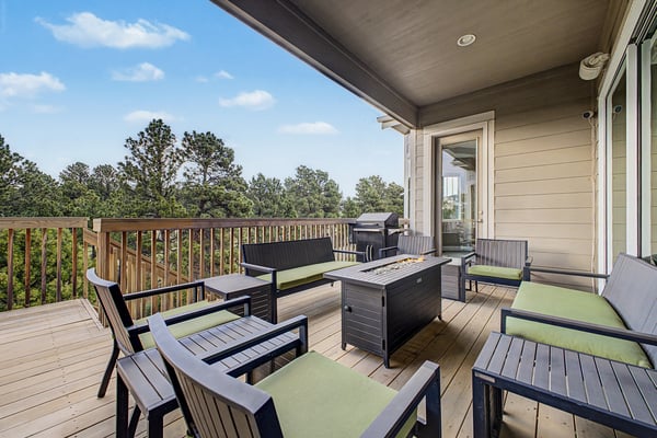 Spacious outdoor deck features comfortable seating and scenic views, perfect for relaxing or entertaining.