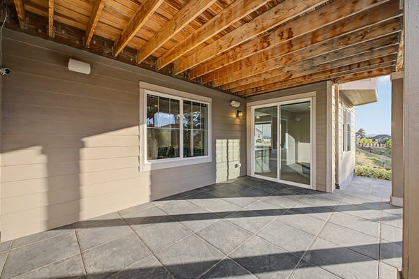 Spacious covered patio area perfect for outdoor entertaining and relaxing, featuring ample natural light.