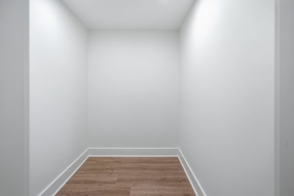 Versatile space ideal for storage or as a creative nook, featuring sleek flooring and clean lines.