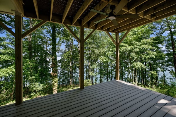 Enjoy expansive tree-lined views from this spacious deck, perfect for outdoor gatherings and relaxation.