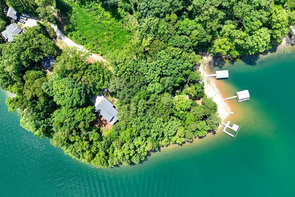 Discover this unique waterfront property, featuring lush greenery and private docks for endless relaxation and recreation.