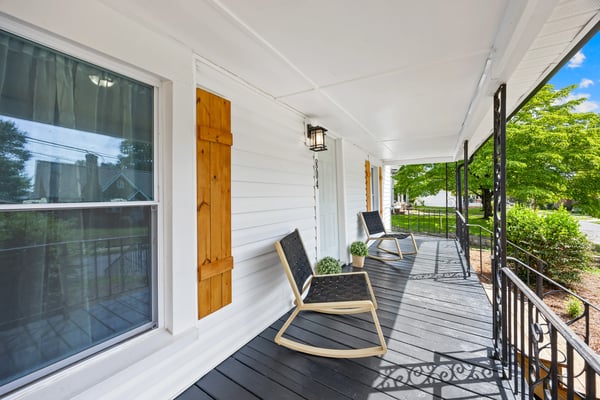 Relax on the spacious front porch, perfect for enjoying morning coffee and neighborhood views.