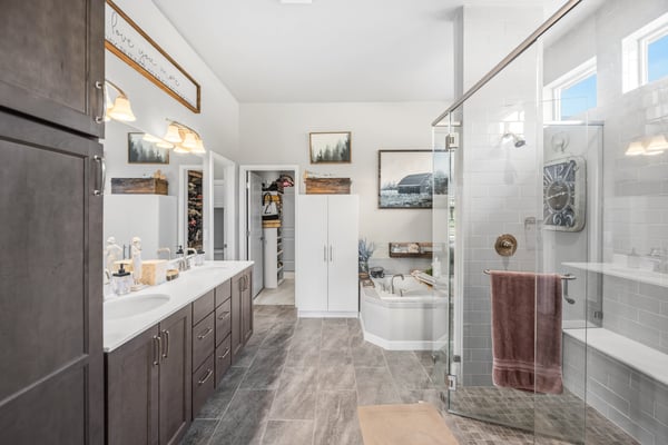 Primary Suite with attached 5 piece bath and walk in closet.