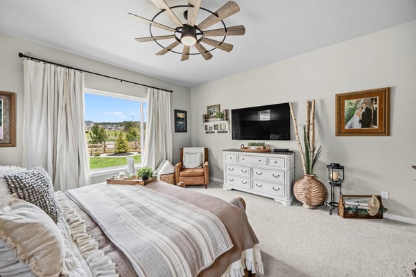 Primary Suite with attached 5 piece bath and walk in closet.