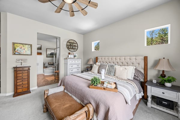 Primary Suite with attached 5 piece bath and walk in closet.
