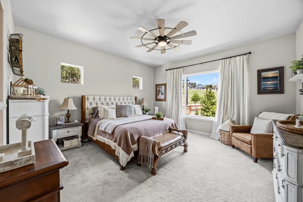 Primary Suite with attached 5 piece bath and walk in closet.