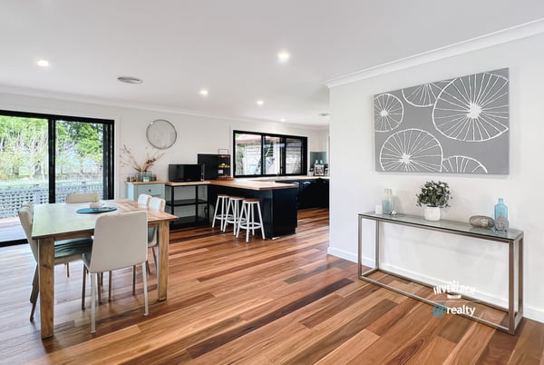 Spacious open-plan living area with modern finishes, large windows, and abundant natural light throughout.