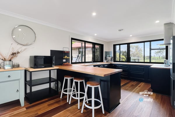 Bright and functional kitchen featuring modern appliances, ample counter space, and scenic views through expansive windows.