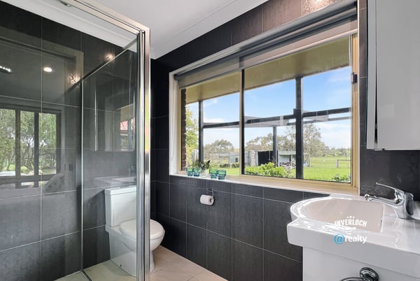 Bright bathroom featuring modern fixtures and scenic views, perfect for relaxation and comfort.