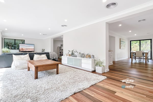 Bright and airy living space with natural light, featuring hardwood floors and an inviting, open layout.