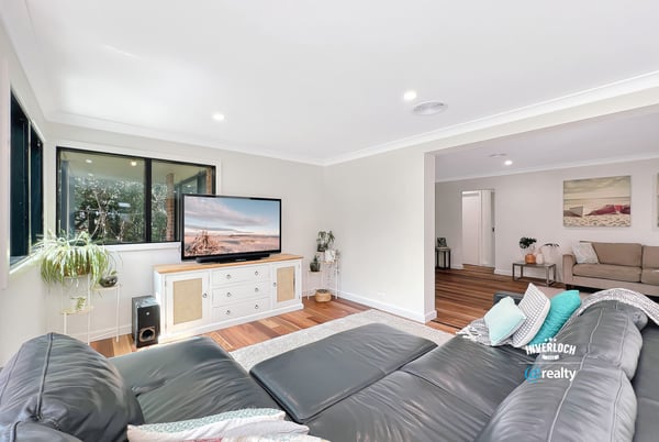 Bright and spacious living area featuring modern furnishings and large windows for natural light.