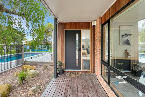 Discover modern living with a seamless indoor-outdoor flow, featuring a sleek entry and inviting surroundings.