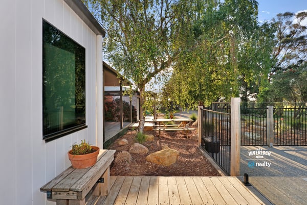 Modern outdoor space featuring a tranquil garden area, perfect for relaxation and entertaining.