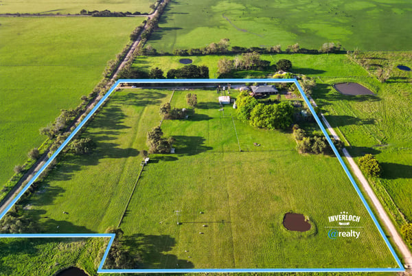 Spacious rural property featuring vast grassy fields, multiple water features, and expansive potential for development.