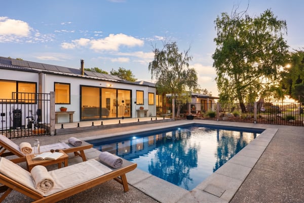 This modern home features a private pool and spacious outdoor area, perfect for entertaining and relaxation.