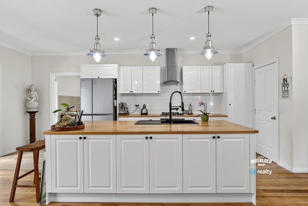 Bright and modern kitchen featuring ample cabinetry, a spacious island, and updated appliances for convenience.