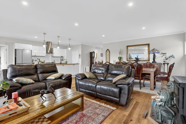 Spacious open-plan living area featuring modern finishes and a seamless flow to the dining space.