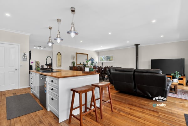 Spacious open-plan living area with modern kitchen, perfect for entertaining and comfortable family gatherings.