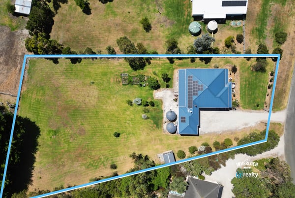 Spacious property featuring a large yard, ideal for outdoor activities and featuring sustainable solar panels.