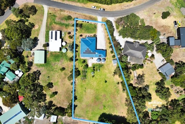 Spacious property featuring a modern home, expansive yard, and ample potential in a peaceful neighborhood.