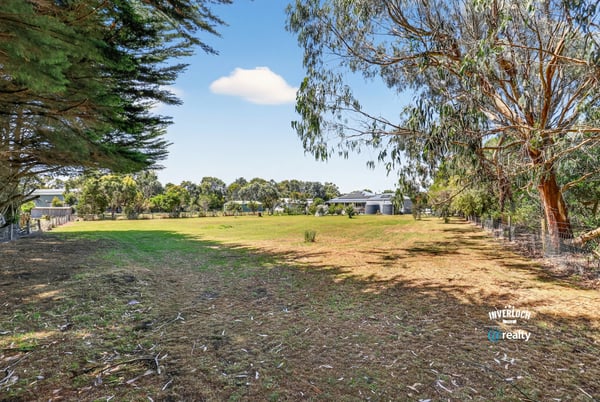 Spacious vacant lot with mature trees, offering limitless potential for your dream home or investment opportunity.