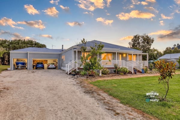 This inviting home features spacious gardens, ample parking, and a welcoming front porch in a peaceful setting.