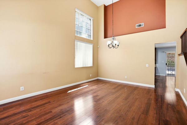 Bright, spacious interior featuring high ceilings and large windows, perfect for modern living and entertaining.