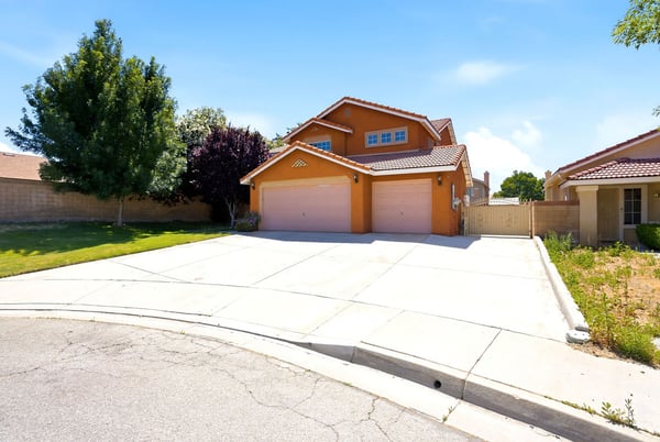 Spacious home featuring a large driveway, ample yard space, and a quiet cul-de-sac location.